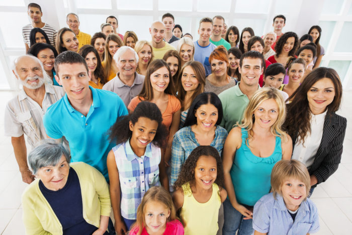 Large group of smiling people.