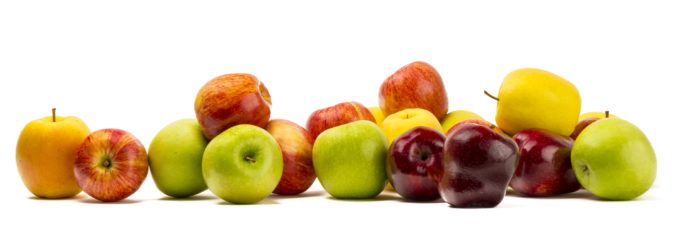 Different varieties of apples over white